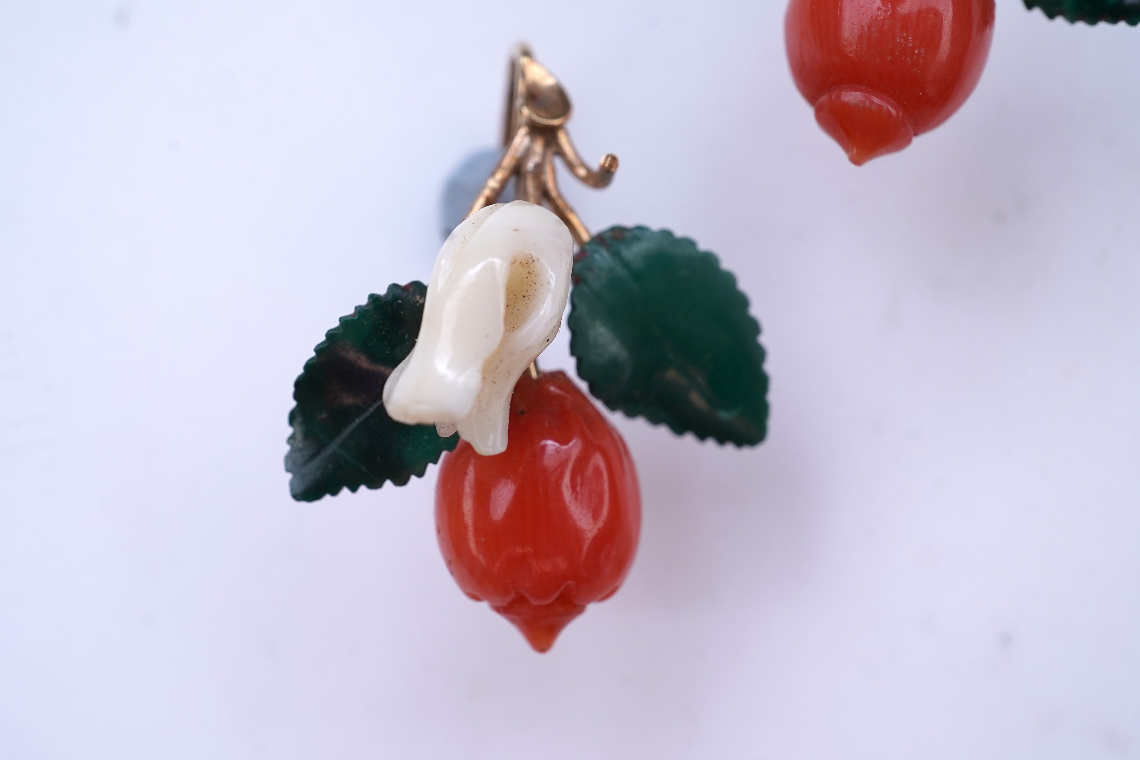 A rare coral and malachite demi-parure, mid 19th century and later